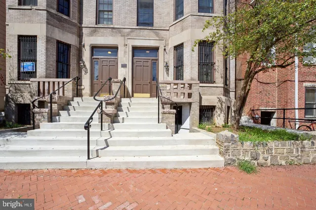 a view of a building with a fountain