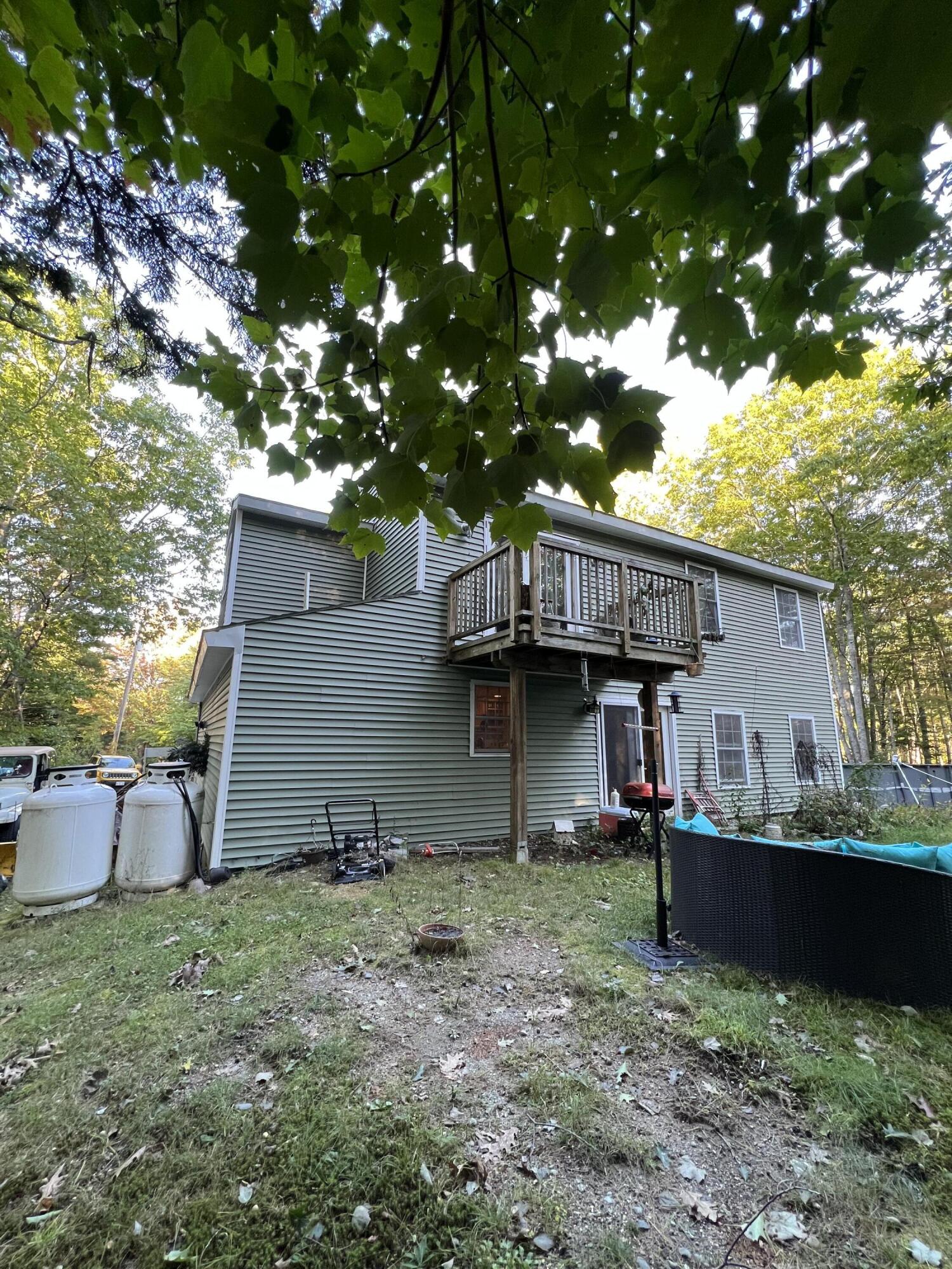 291 Morgan Bay Road Surry, ME 04684 - Photo 32 of 32 Back Yard from side