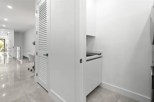 a bathroom with a toilet sink a shower and a mirror