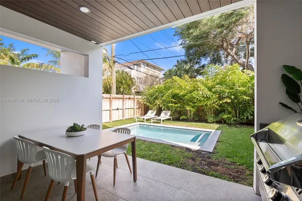 an aerial view of residential houses with outdoor space