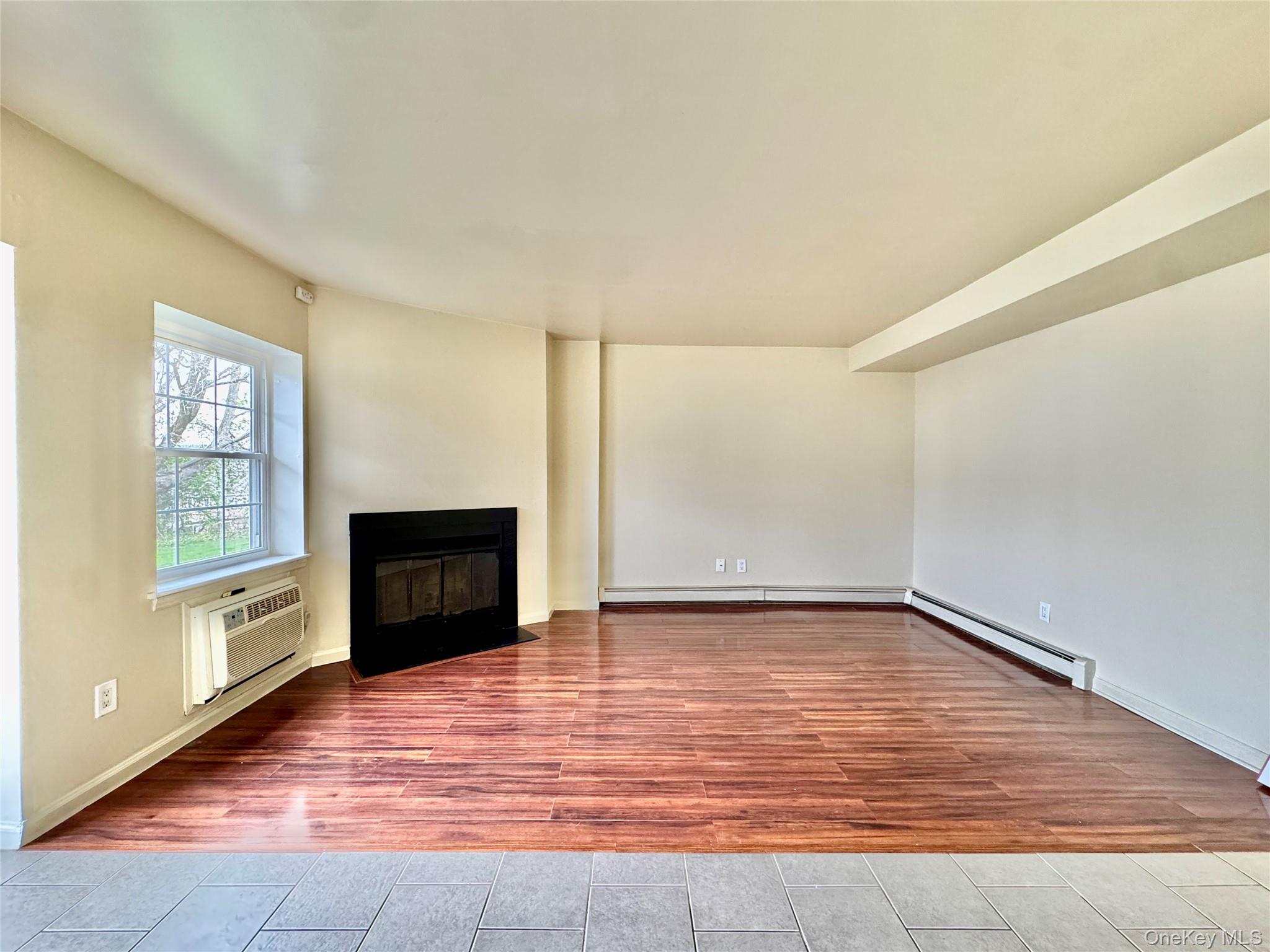 5 Lexington Hills Road, Unit 7 Harriman, NY 10926 - Photo 1 of 21 a view of empty room with a fireplace and windows