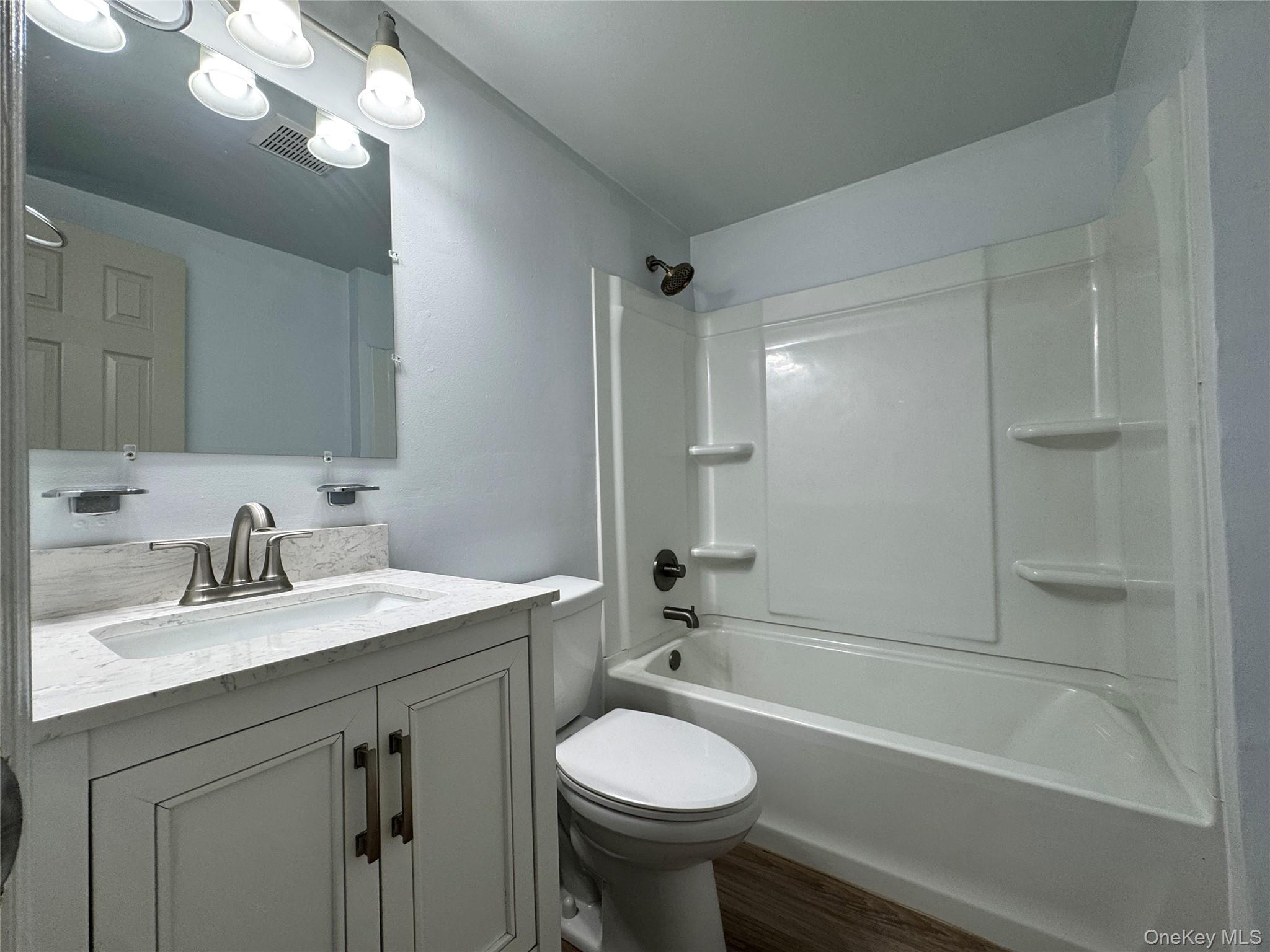 5 Lexington Hills Road, Unit 7 Harriman, NY 10926 - Photo 17 of 21 a bathroom with a sink a toilet and shower