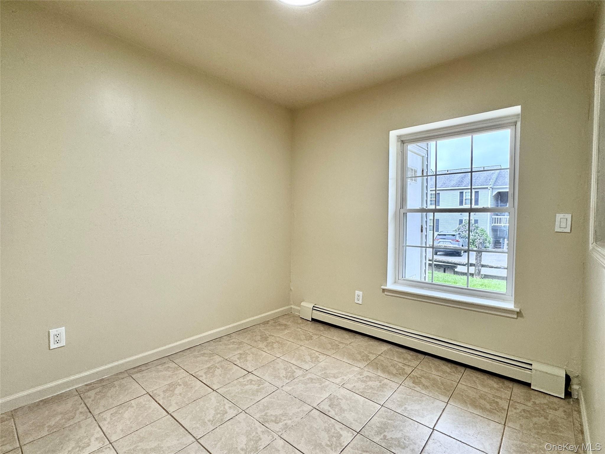 5 Lexington Hills Road, Unit 7 Harriman, NY 10926 - Photo 7 of 21 an empty room with windows
