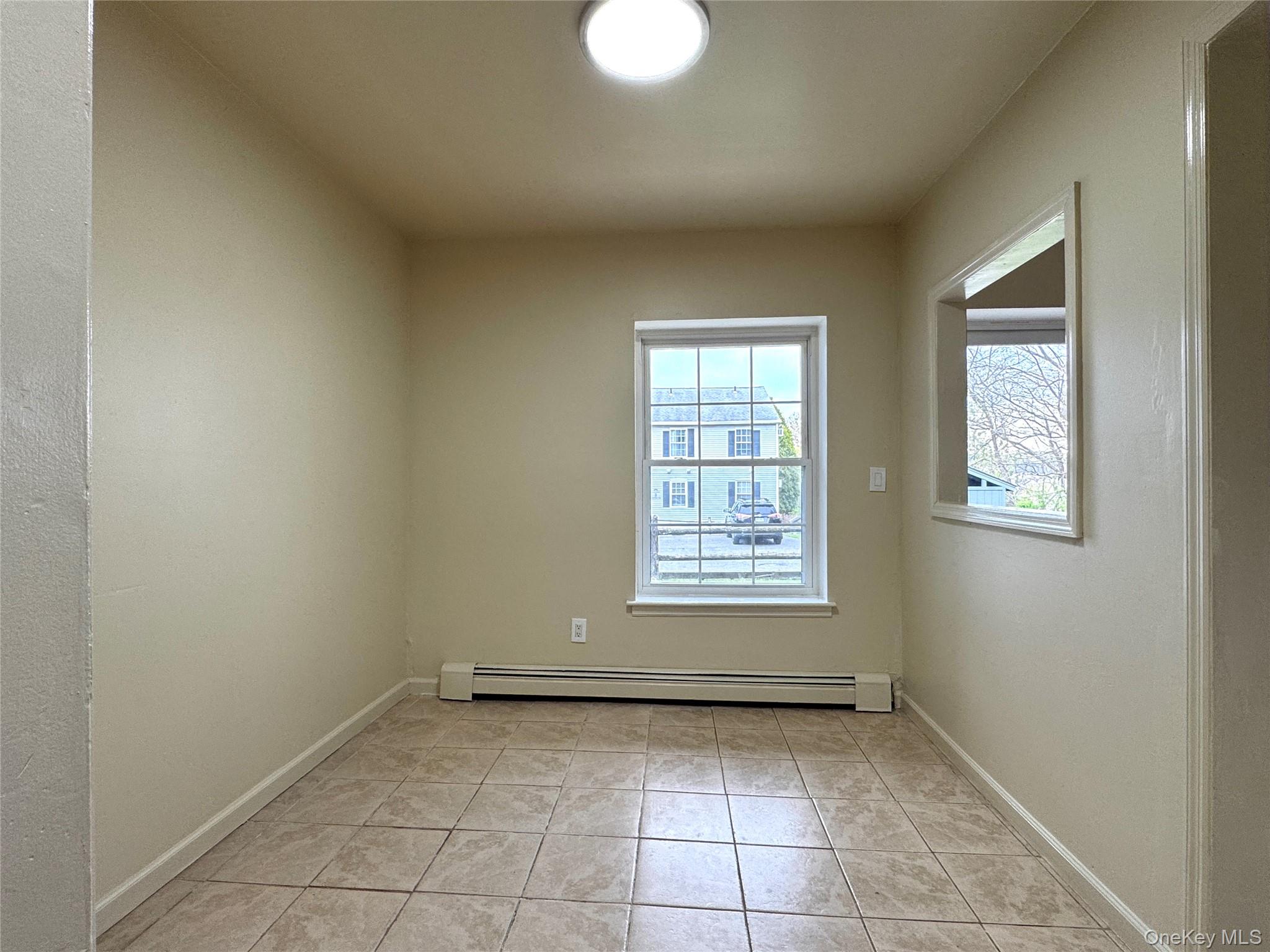5 Lexington Hills Road, Unit 7 Harriman, NY 10926 - Photo 8 of 21 an empty room with windows