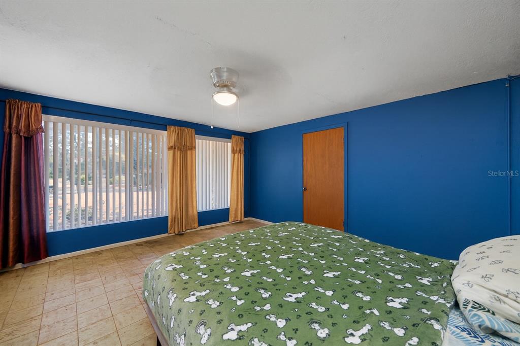 1324 Milton Street Clearwater, FL 33756 - Photo 15 of 47 a bedroom with a bed and a window