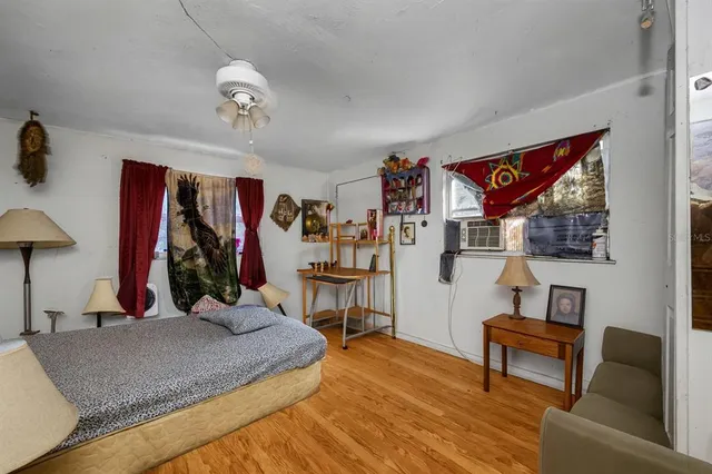 a bathroom with a shower a toilet and a sink