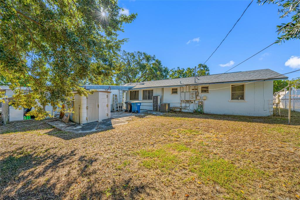 1324 Milton Street Clearwater, FL 33756 - Photo 36 of 47 a view of a house with backyard and tree