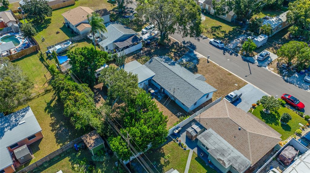 1324 Milton Street Clearwater, FL 33756 - Photo 40 of 47 an aerial view of multiple houses with yard
