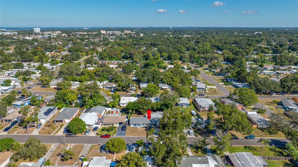 1324 Milton Street Clearwater, FL 33756 - Photo 4 of 47 an aerial view of residential houses with outdoor space and trees