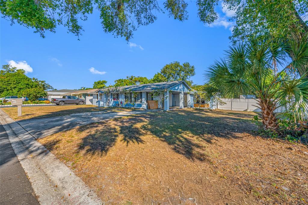 1324 Milton Street Clearwater, FL 33756 - Photo 44 of 47 a view of a house with a yard