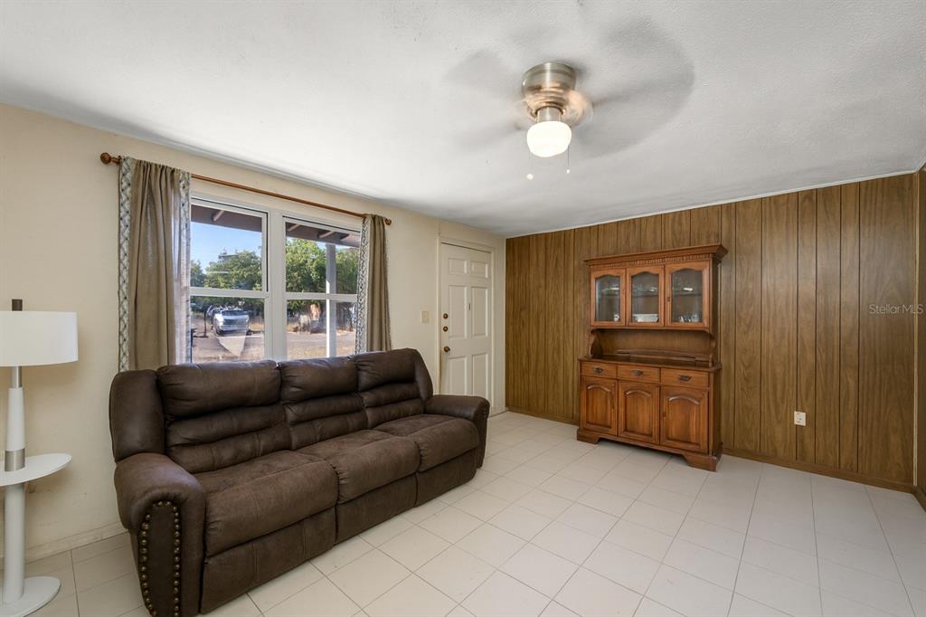 1324 Milton Street Clearwater, FL 33756 - Photo 9 of 47 a living room with furniture and a window