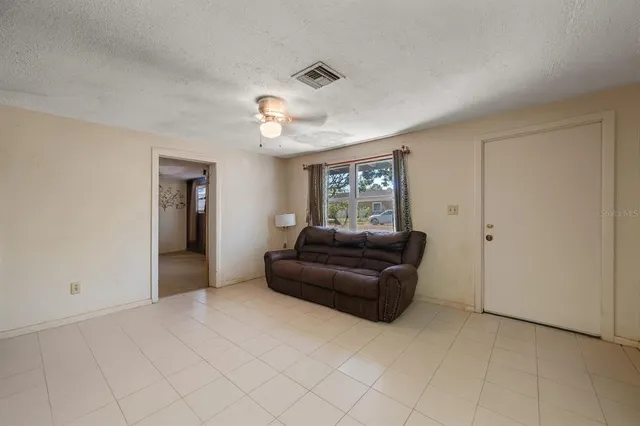 a living room with furniture and a window