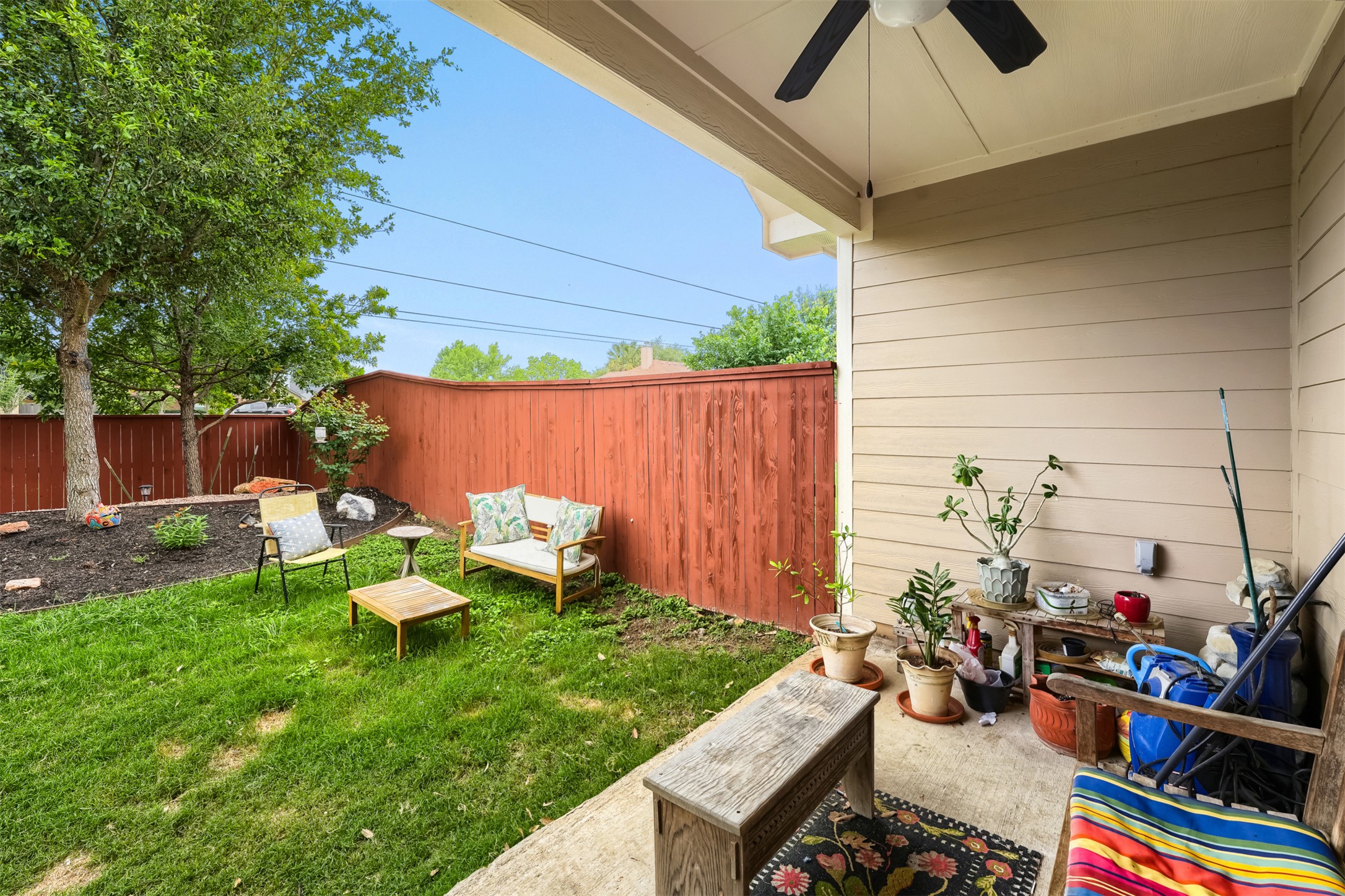 418 High Tech Drive Georgetown, TX 78626 - Photo 24 of 34 Covered patio featuring a ceiling fan and tan siding