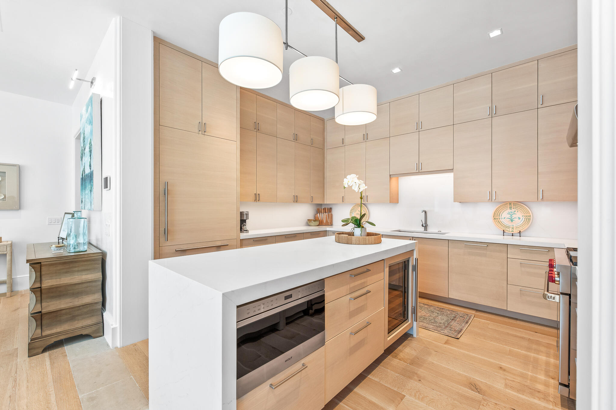 290 Sea Gardens St Inlet Beach, Unit 301 Inlet Beach, FL 32461 - Photo 25 of 43 a kitchen with a sink dishwasher a stove and a refrigerator with wooden floor