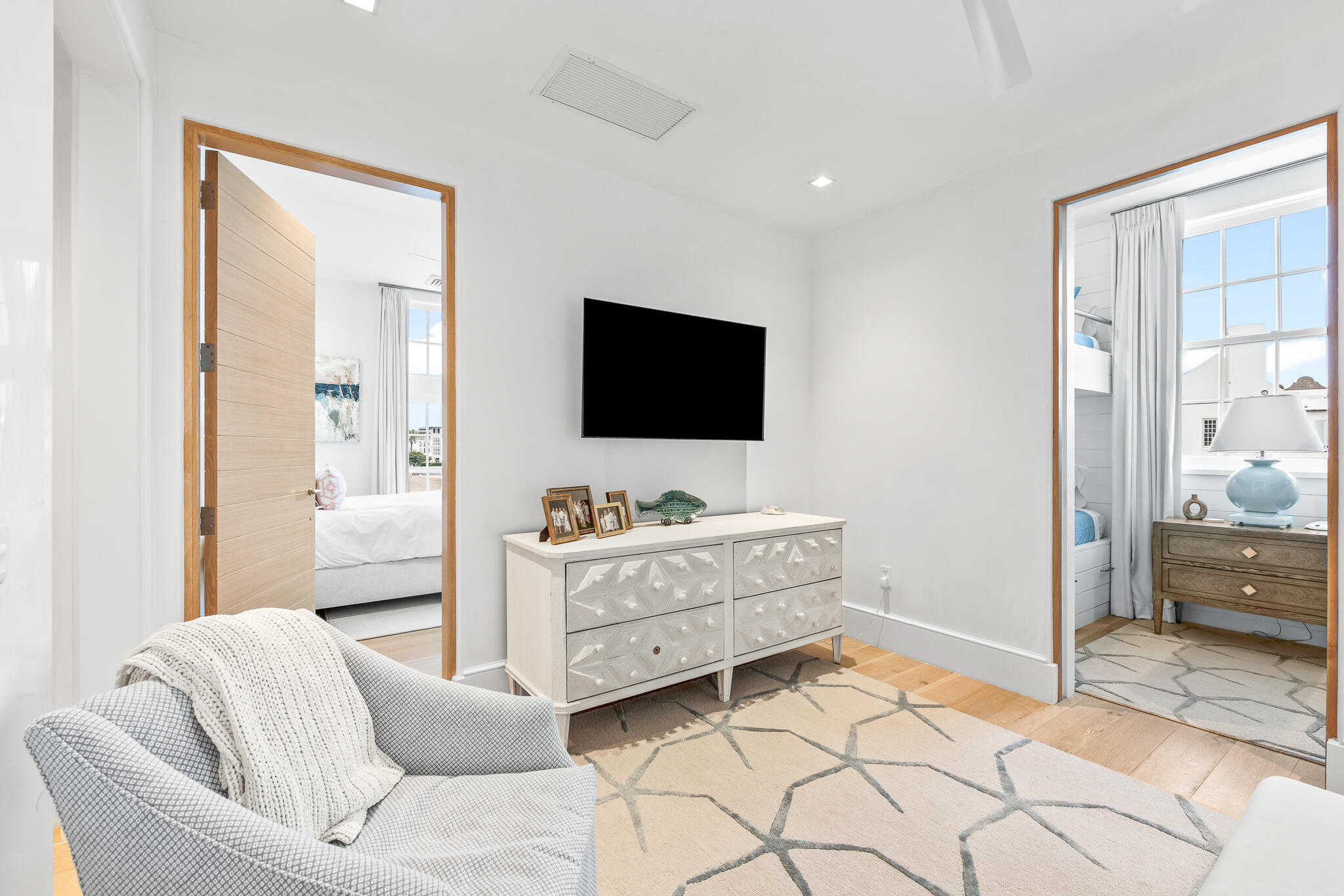 290 Sea Gardens St Inlet Beach, Unit 301 Inlet Beach, FL 32461 - Photo 6 of 43 a living room with furniture and a flat screen tv