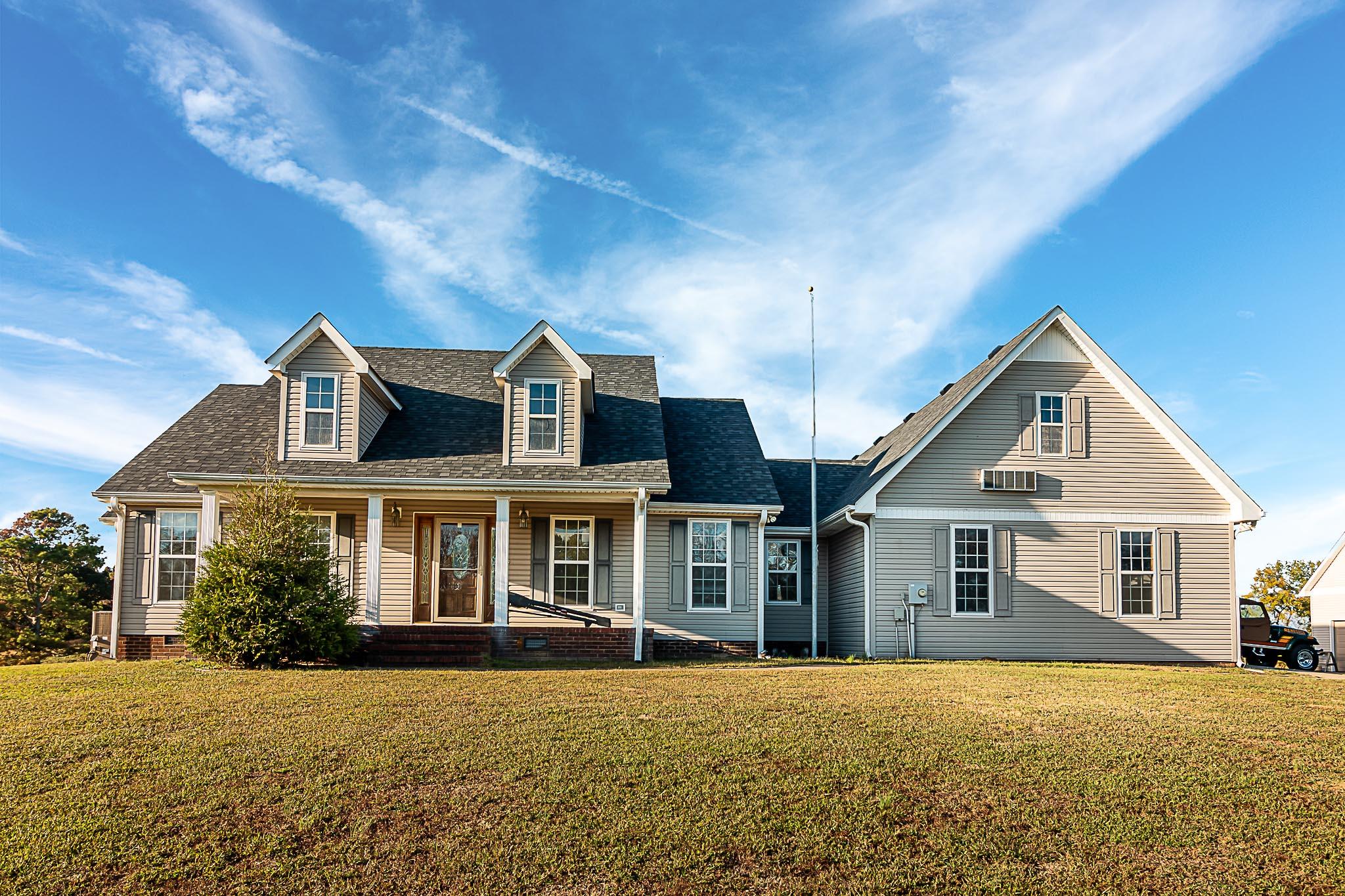 1555 Poplar Hill Road Prospect, TN 38477 - Photo 2 of 29 a front view of a house with a yard