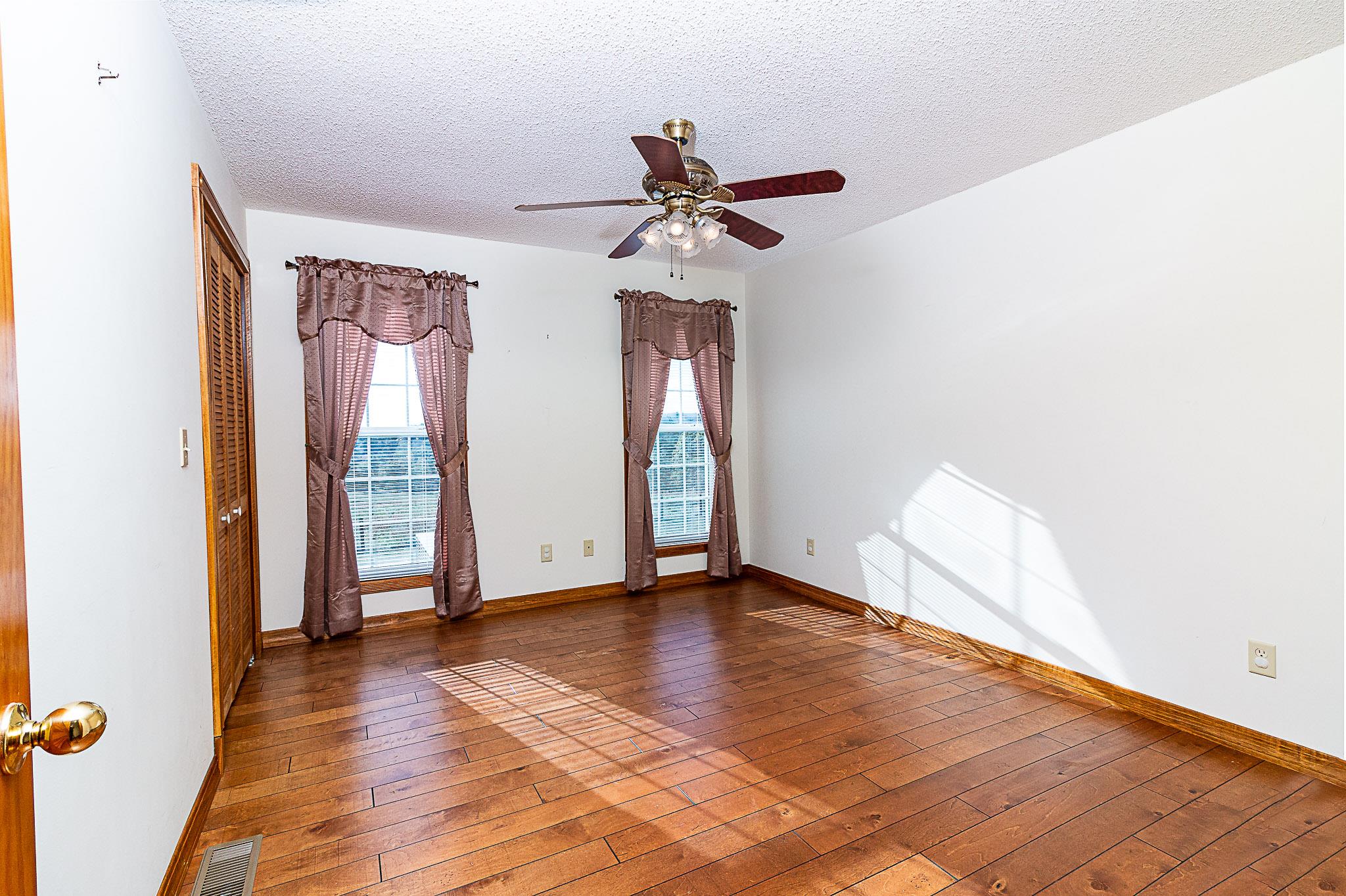 1555 Poplar Hill Road Prospect, TN 38477 - Photo 11 of 29 a view of an empty room with window and wooden floor