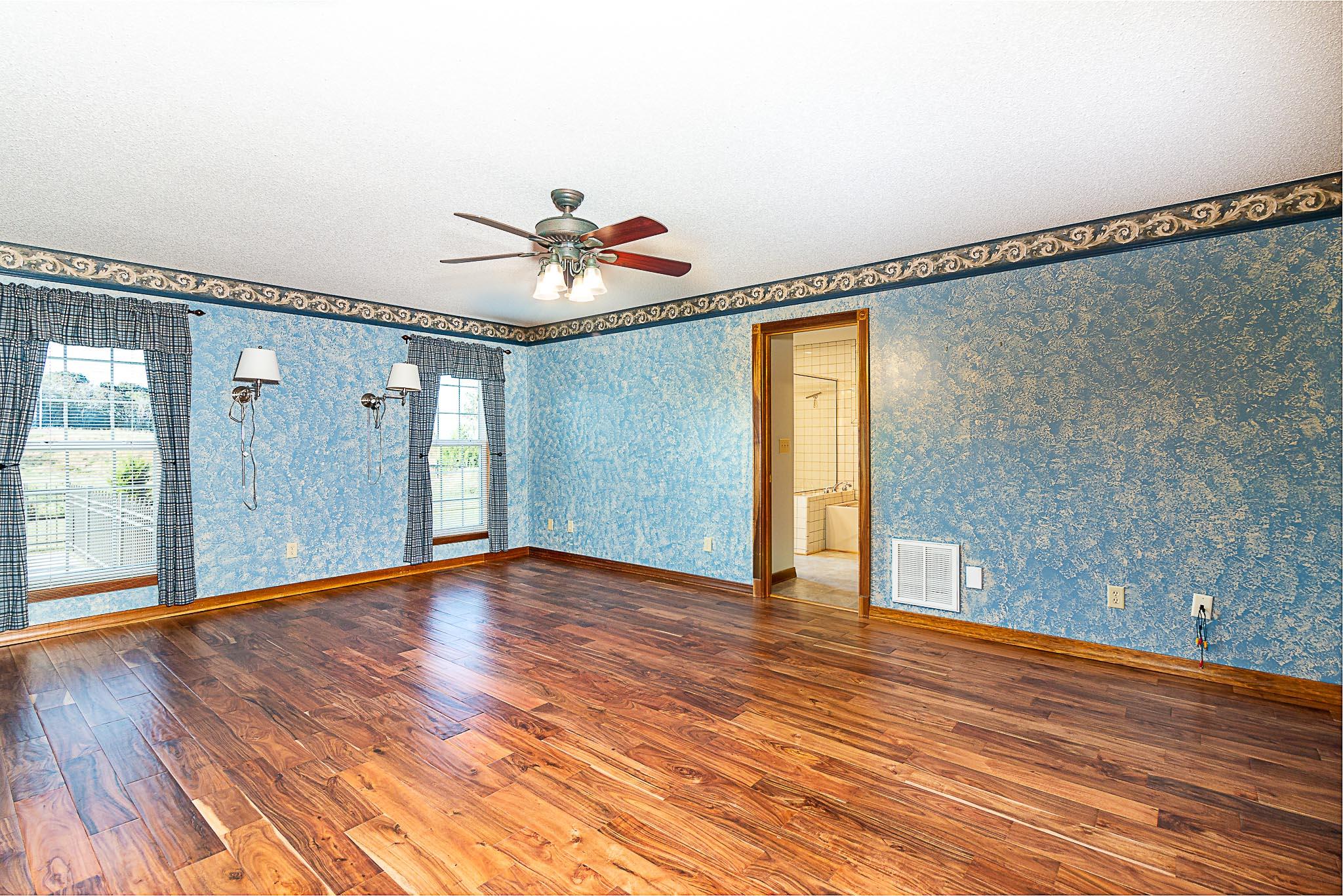 1555 Poplar Hill Road Prospect, TN 38477 - Photo 14 of 29 a view of an empty room with wooden floor and a window