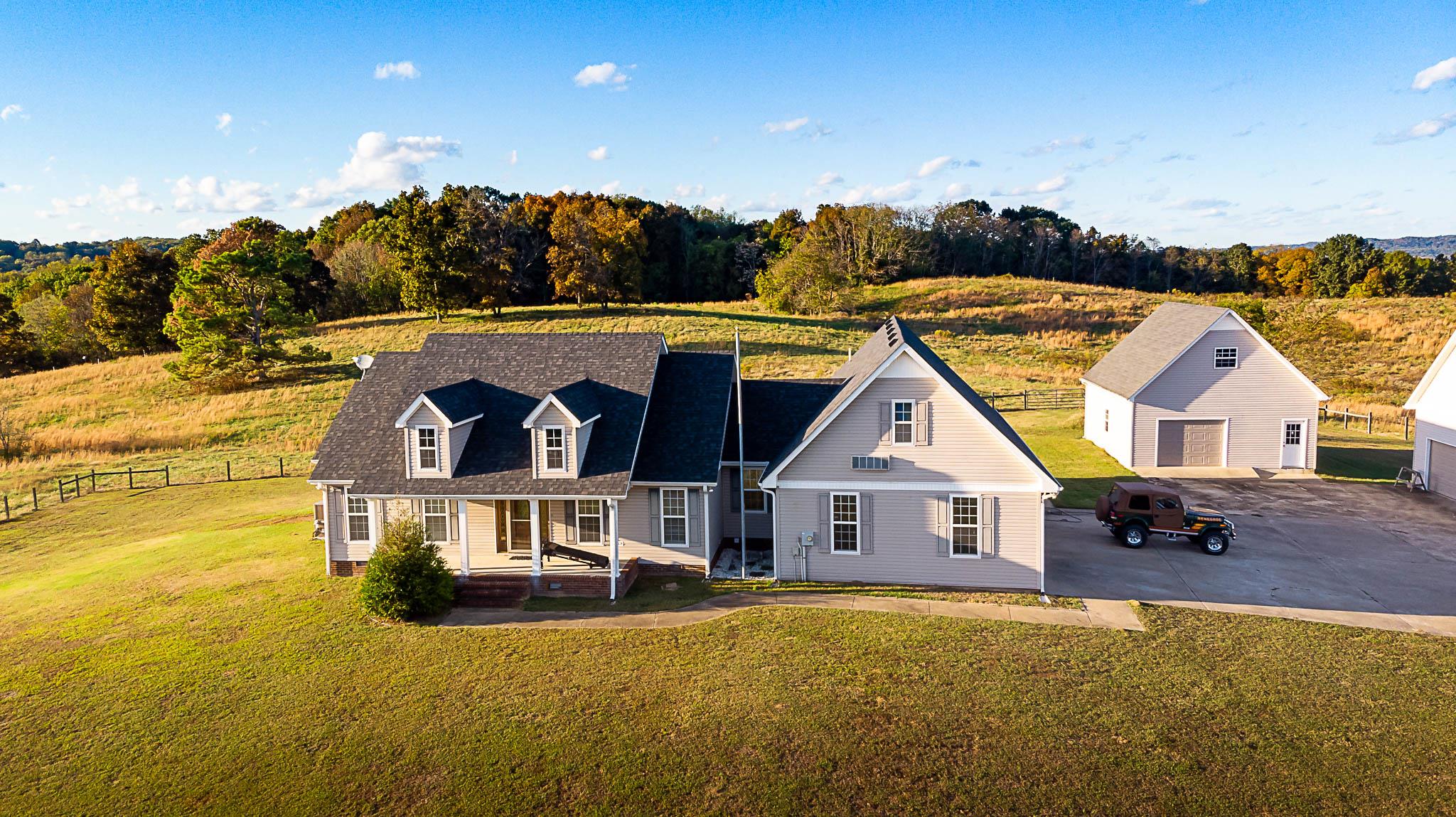1555 Poplar Hill Road Prospect, TN 38477 - Photo 22 of 29 a view of houses with swimming pool