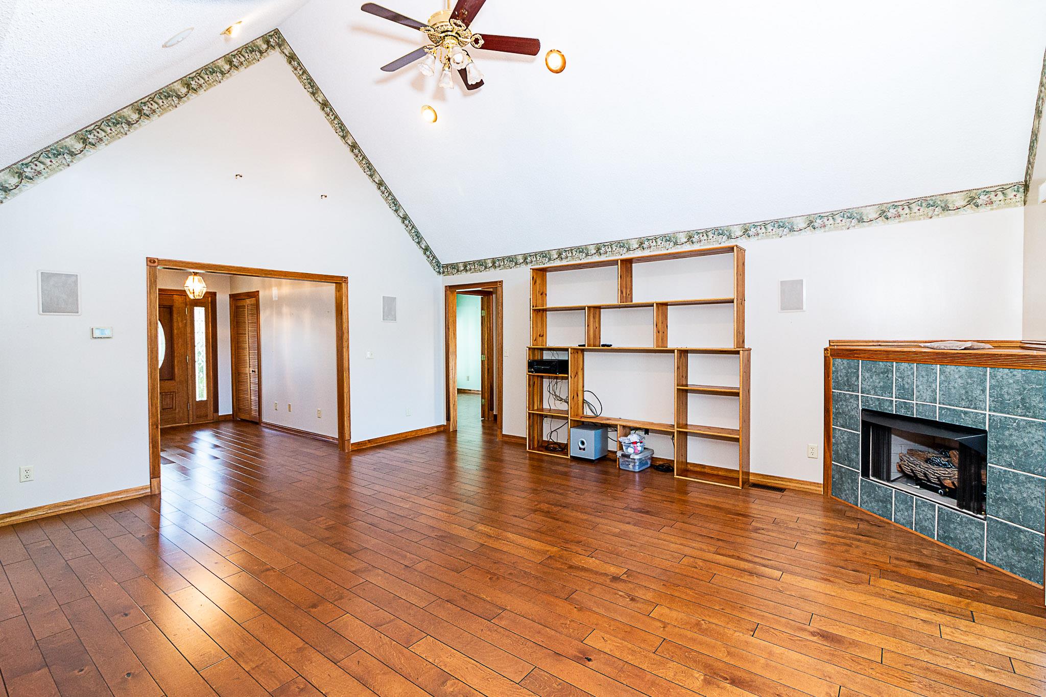 1555 Poplar Hill Road Prospect, TN 38477 - Photo 6 of 29 a view of a livingroom with wooden floor and a fireplace