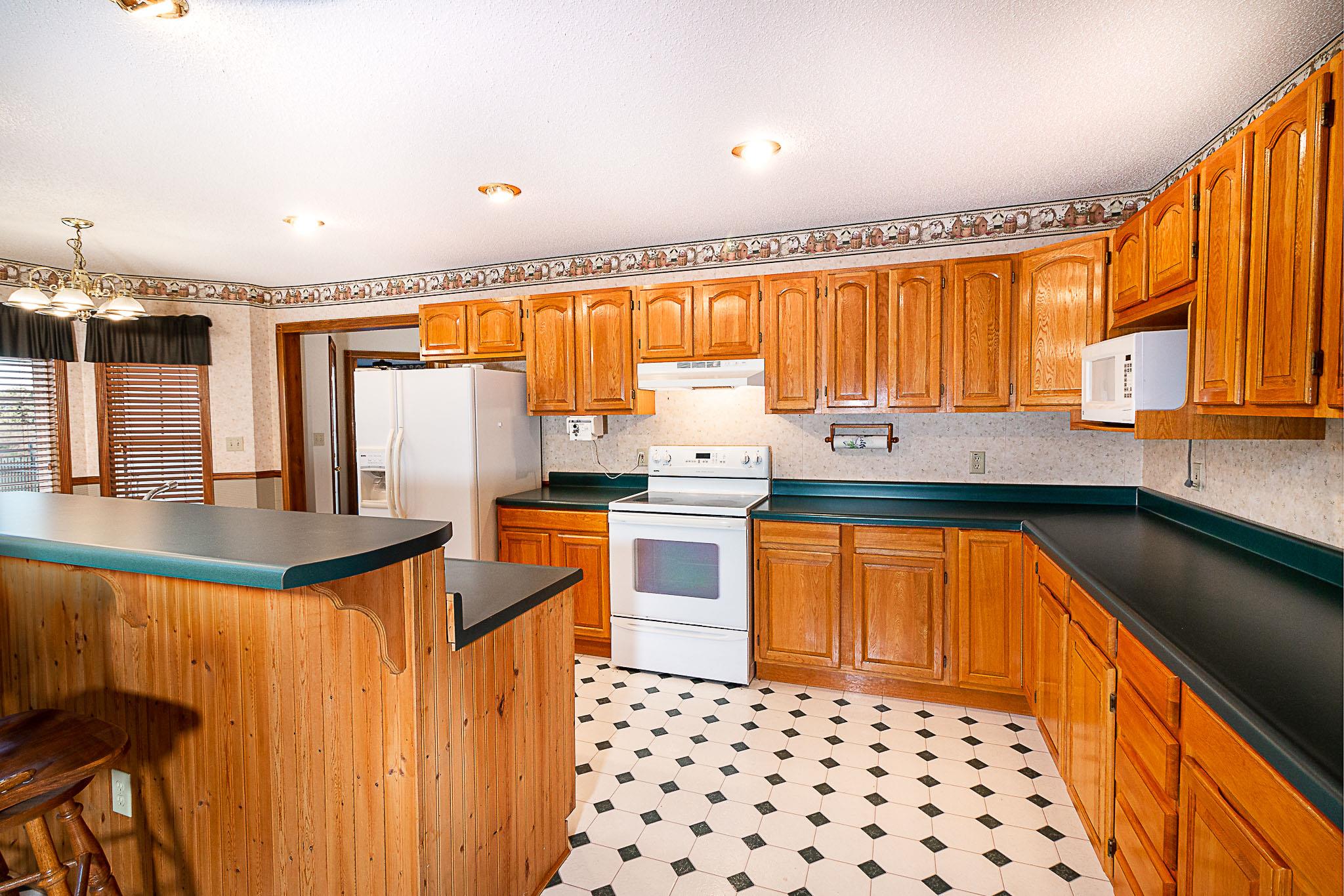 1555 Poplar Hill Road Prospect, TN 38477 - Photo 7 of 29 a kitchen with stainless steel appliances a stove a sink and a refrigerator