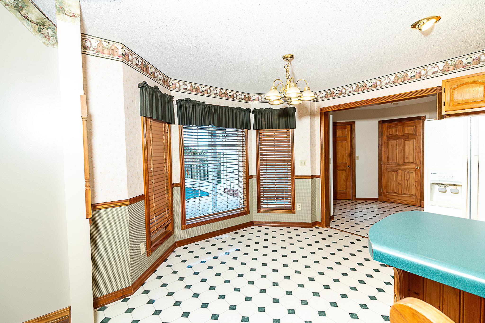 1555 Poplar Hill Road Prospect, TN 38477 - Photo 8 of 29 a bedroom with windows and bed
