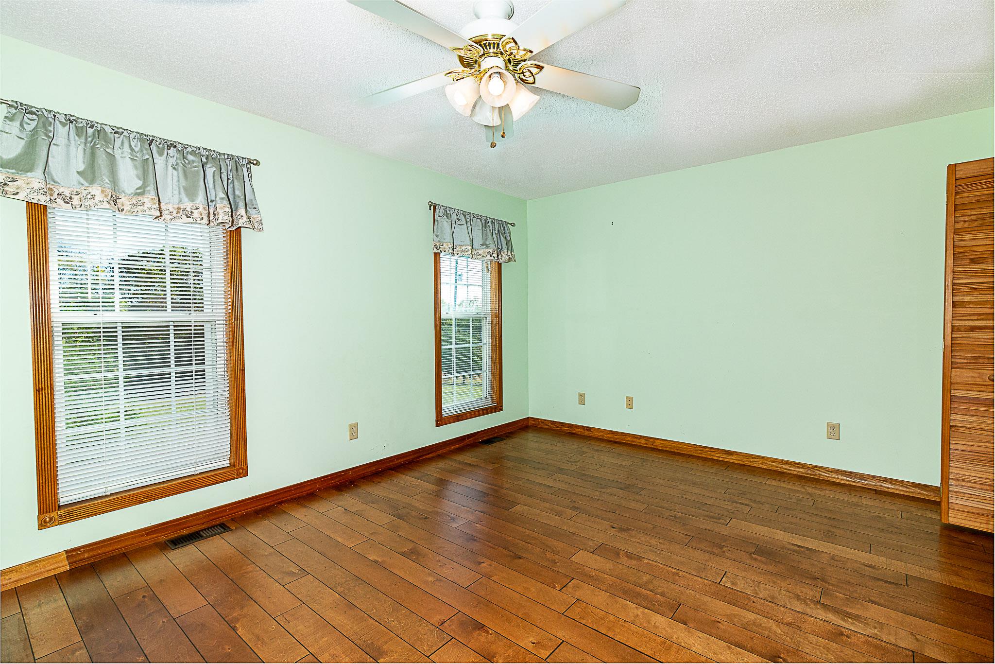 1555 Poplar Hill Road Prospect, TN 38477 - Photo 10 of 29 a view of an empty room with window and wooden floor