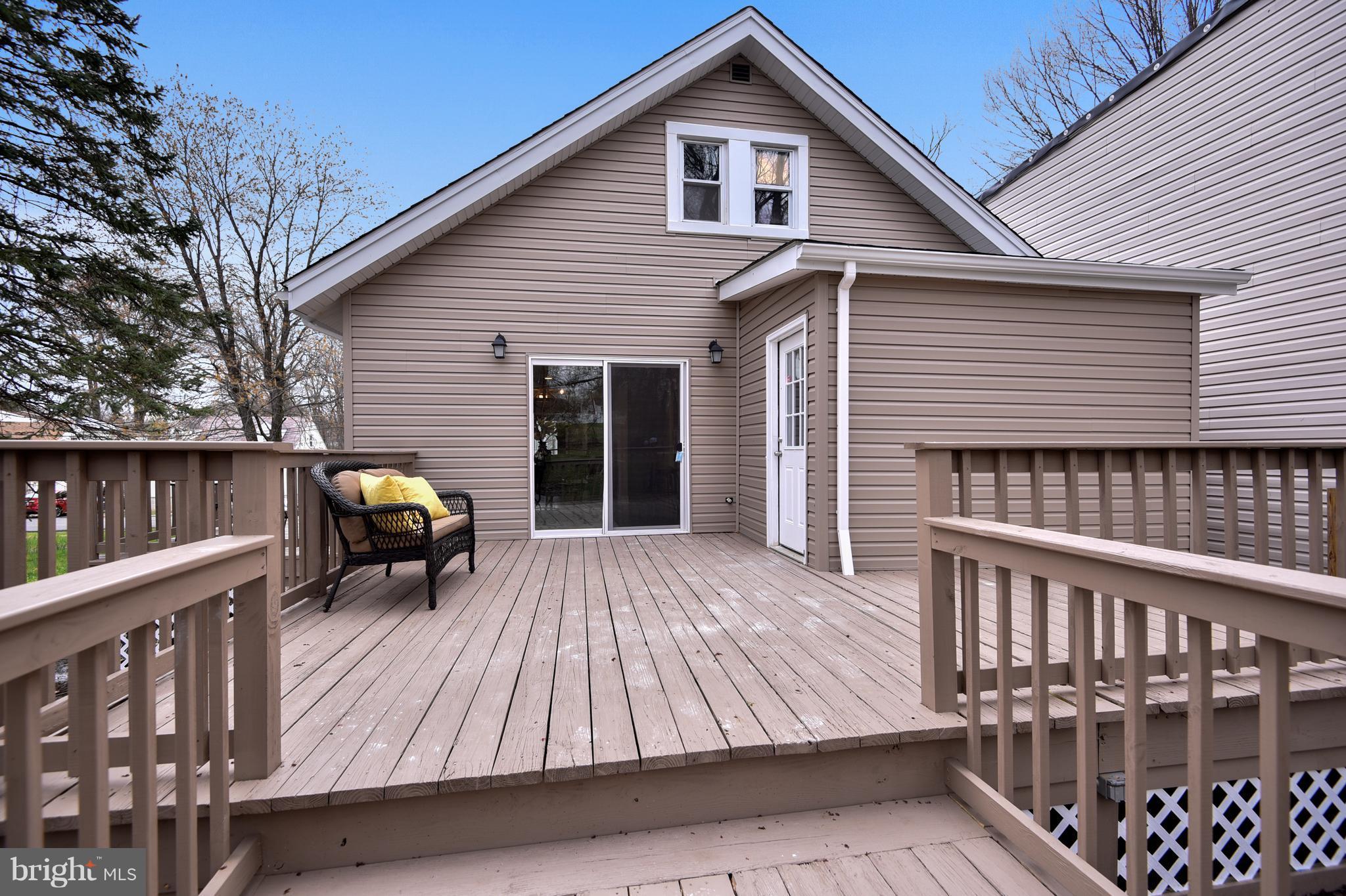 8309 Karl Avenue Rosedale, MD 21237 - Photo 29 of 30 a view of a house with wooden deck and furniture
