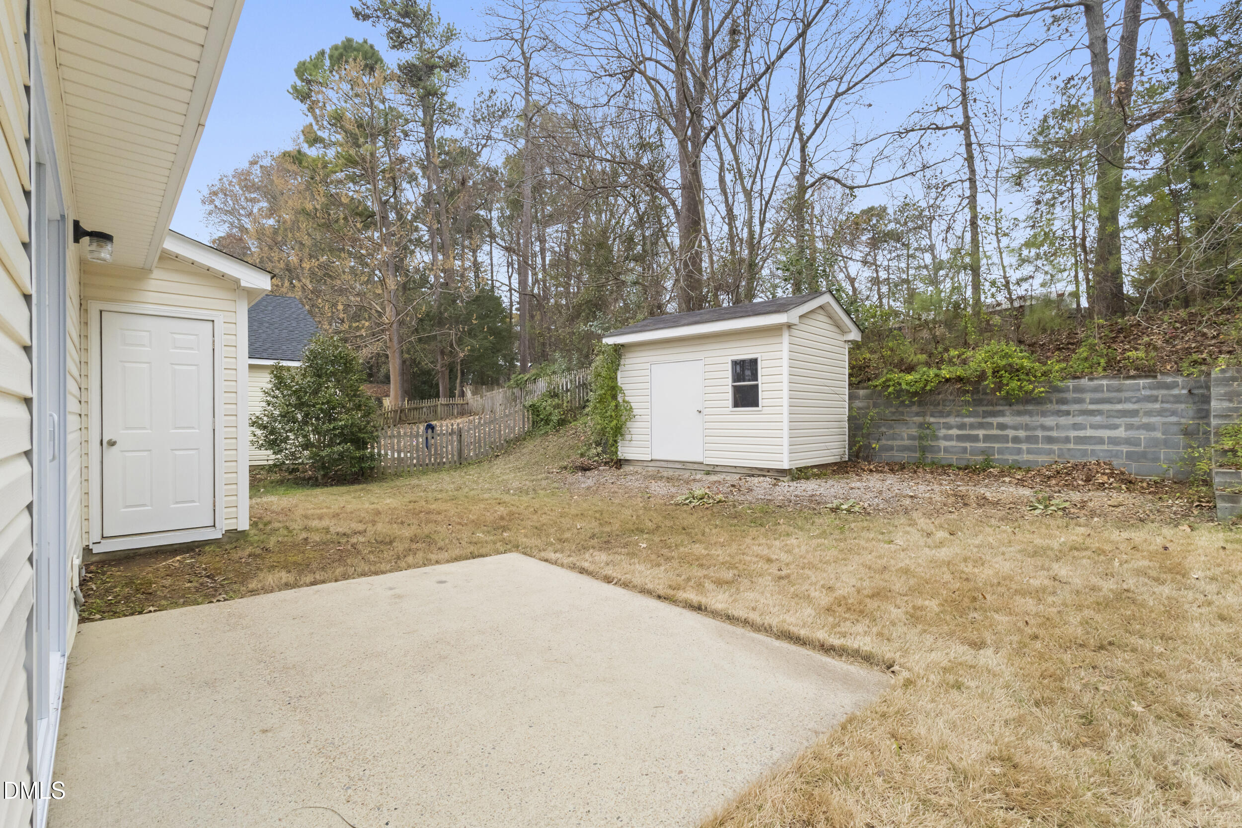 4616 Silverdene Street Raleigh, NC 27616 - Photo 30 of 42 Outdoor living with storage closet and storage shed and flat backyard