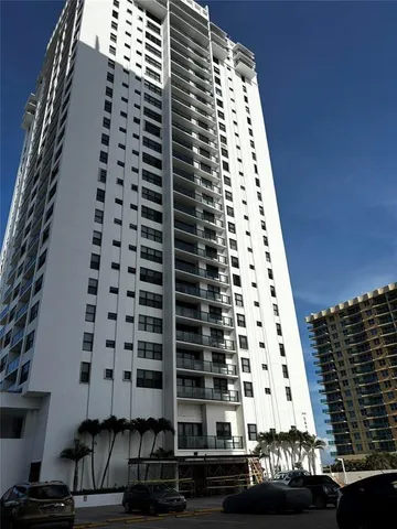 a view of a balcony with a black white checkered floor