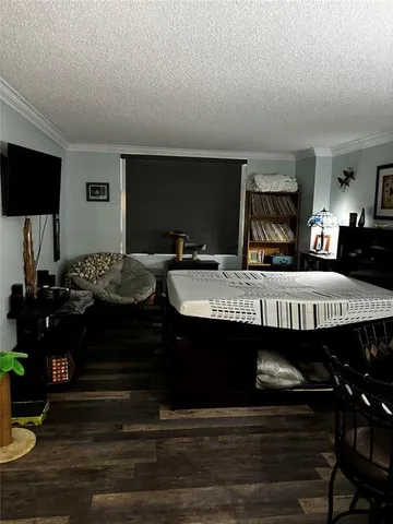 a view of a livingroom with furniture and flat screen tv