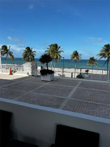 a room with gym equipment and a large window