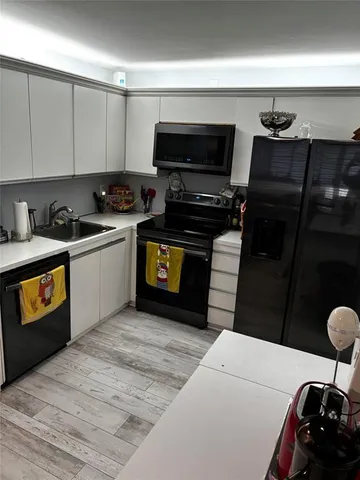 a kitchen with a stove and a microwave