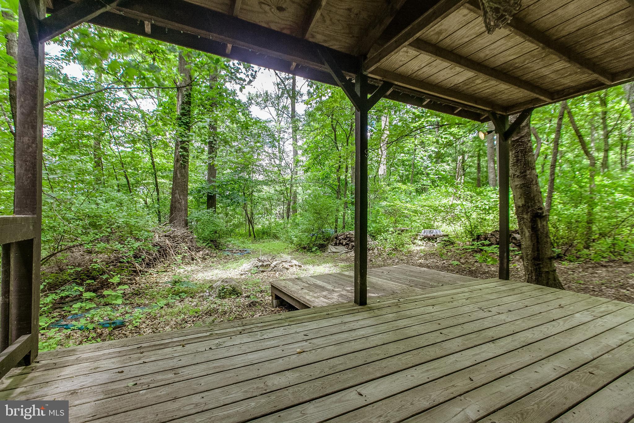 13740 John Kline Road Smithsburg, MD 21783 - Photo 44 of 77 Front porch on the cabin is made for rocking!