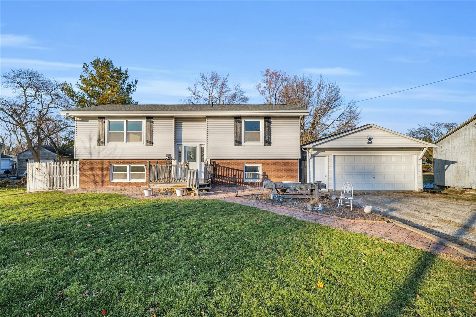 a view of a house with a yard patio and sitting area