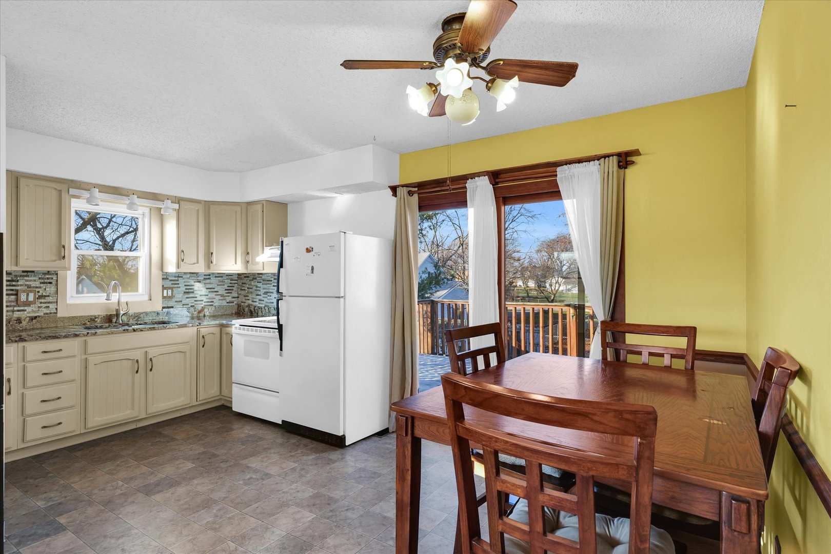 104 Grant Street Philo, IL 61864 - Photo 11 of 44 a view of a dining room with furniture window and outside view
