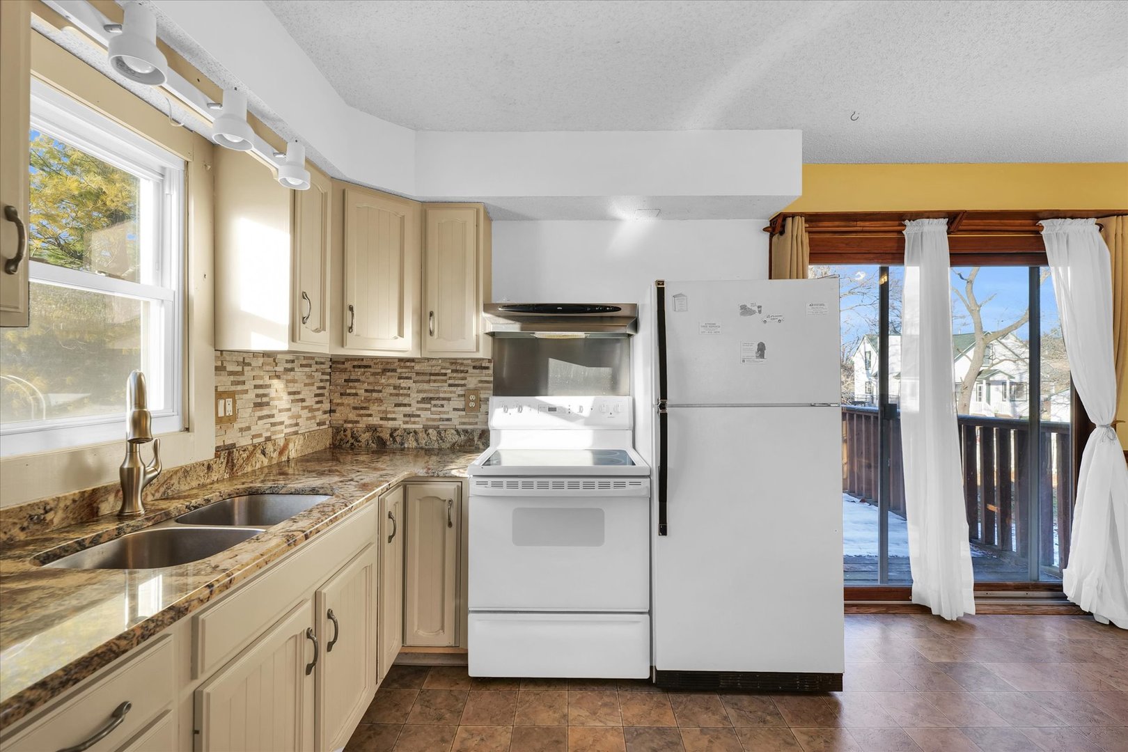 104 Grant Street Philo, IL 61864 - Photo 14 of 44 a kitchen with a refrigerator and a sink