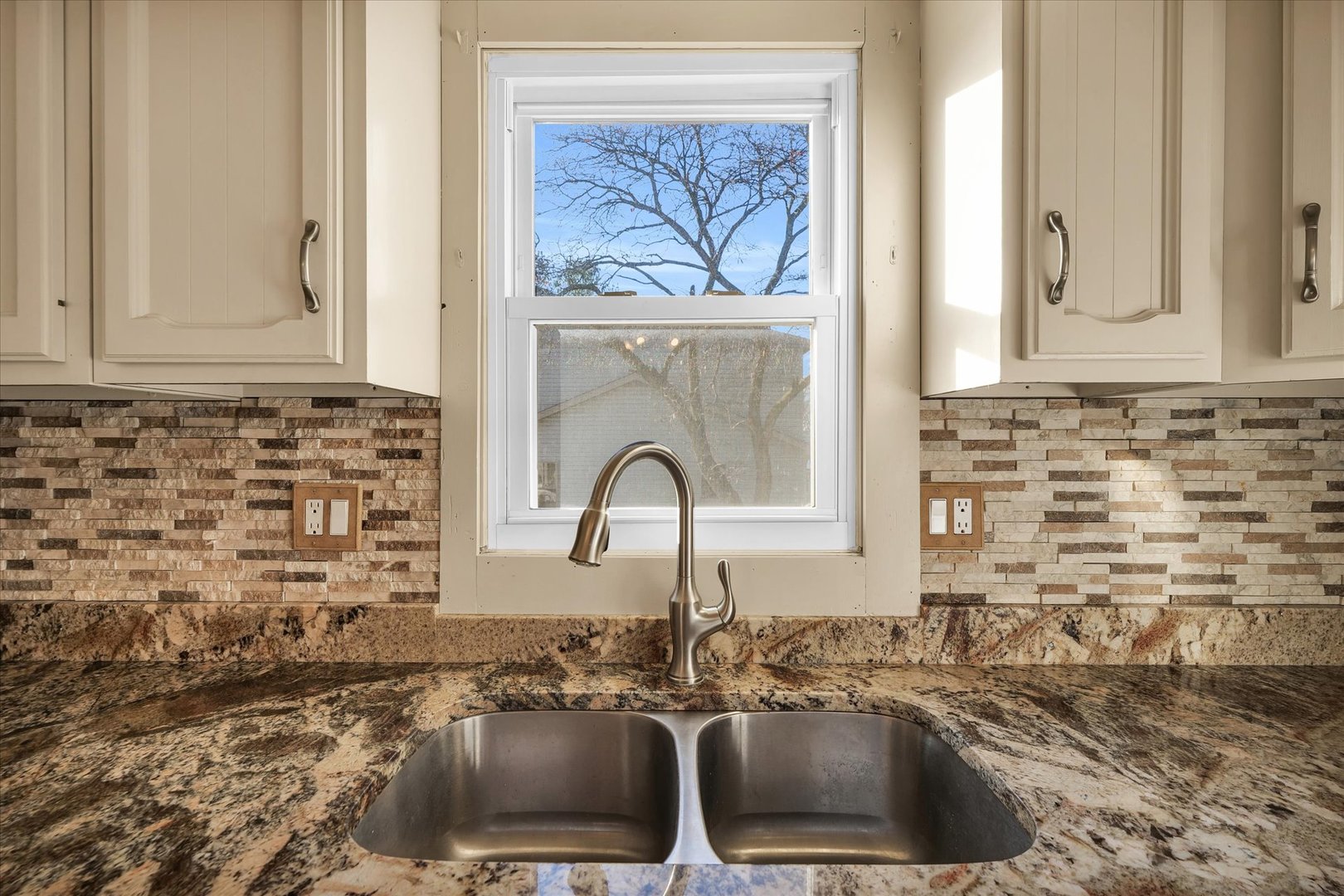 104 Grant Street Philo, IL 61864 - Photo 15 of 44 a kitchen with a sink and a stove top oven