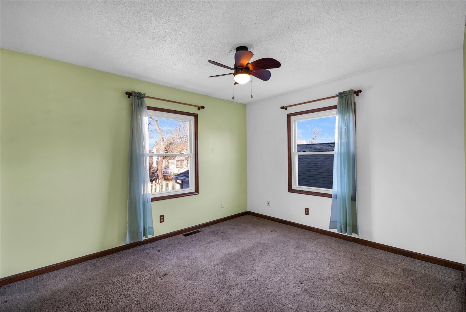 104 Grant Street Philo, IL 61864 - Photo 20 of 44 an empty room with windows and fan