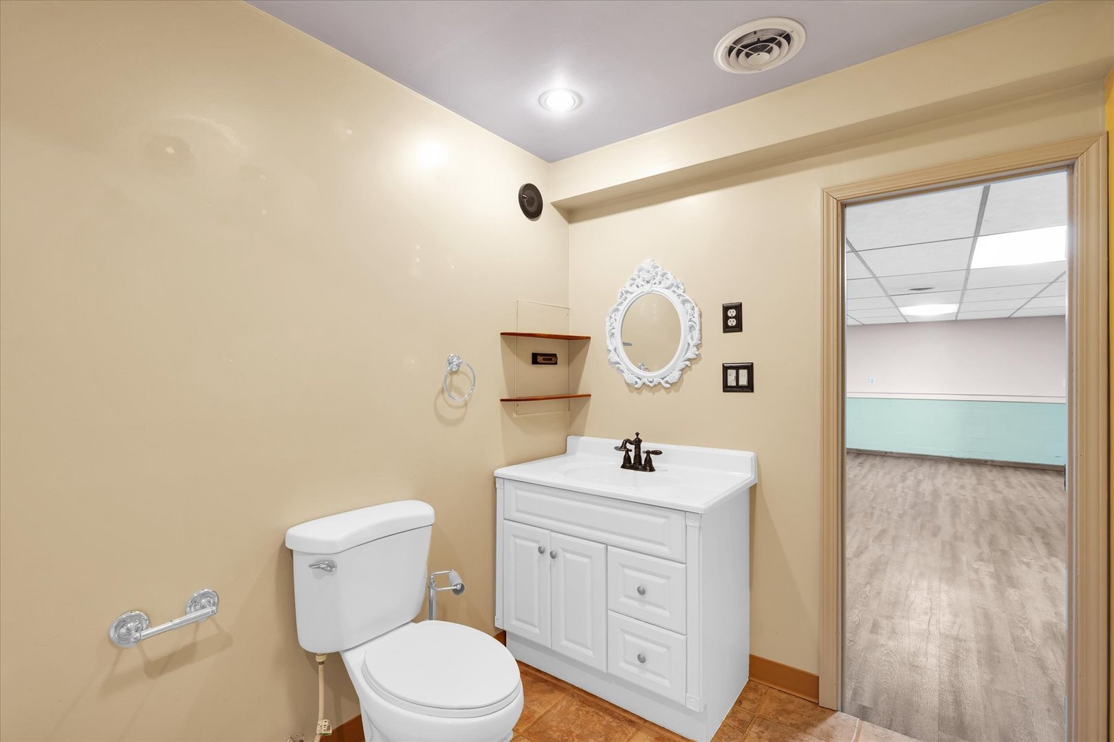 104 Grant Street Philo, IL 61864 - Photo 36 of 44 a bathroom with a sink a toilet a mirror and shower