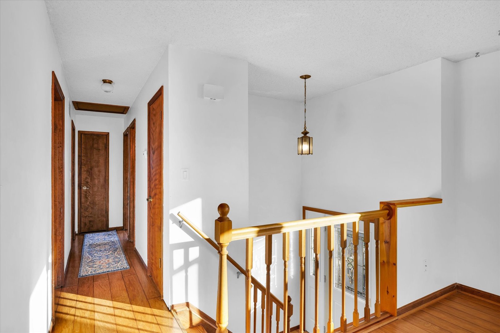 104 Grant Street Philo, IL 61864 - Photo 6 of 44 a view of a hallway with wooden floor and staircase