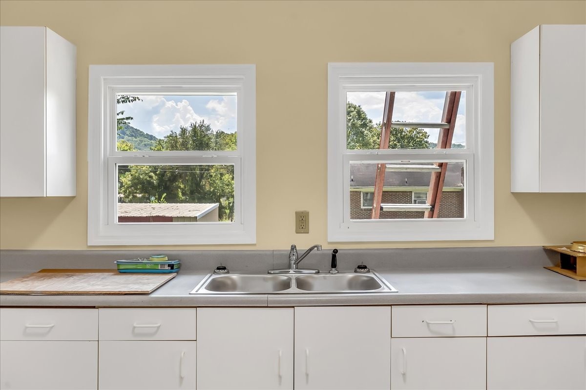104 Locust Street Liberty, TN 37095 - Photo 17 of 57 a bathroom with a sink and a window