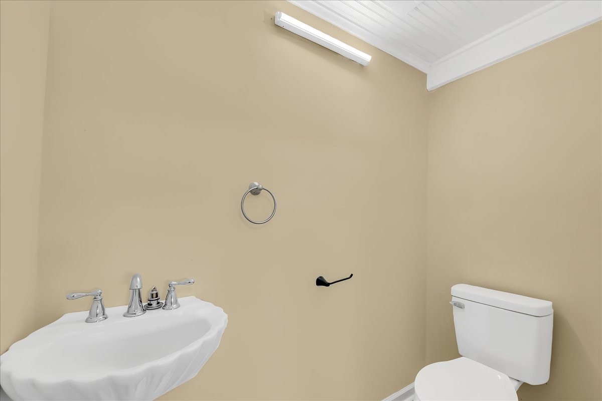 104 Locust Street Liberty, TN 37095 - Photo 19 of 57 a bathroom with a toilet sink and mirror