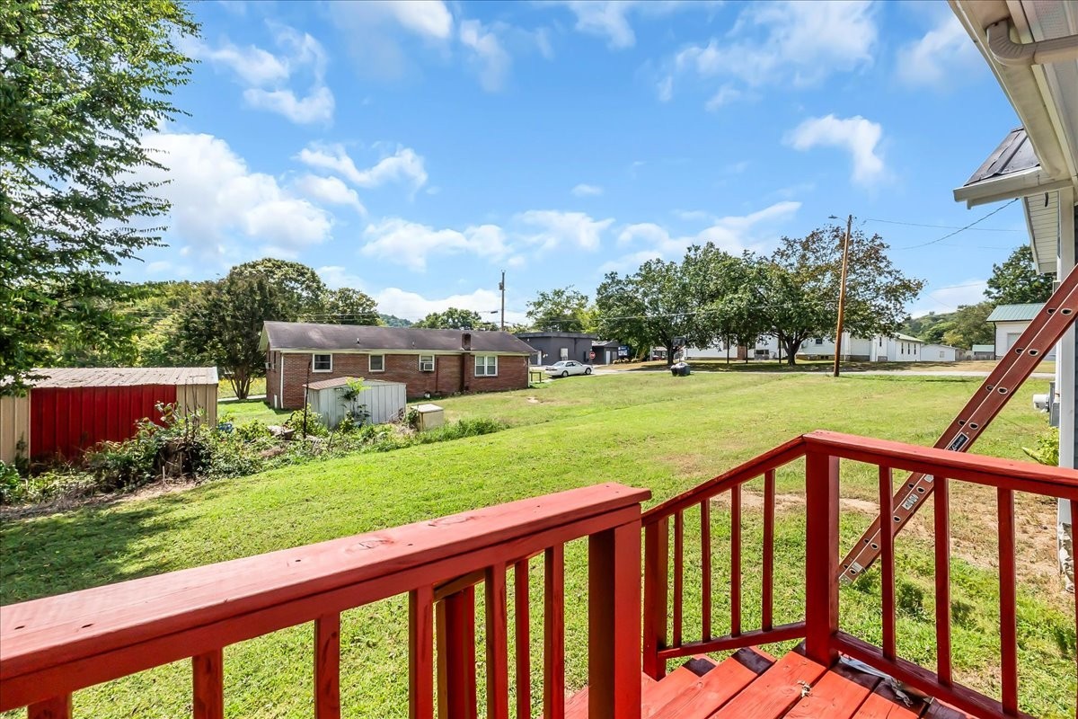 104 Locust Street Liberty, TN 37095 - Photo 34 of 57 a balcony with view of trees in the background