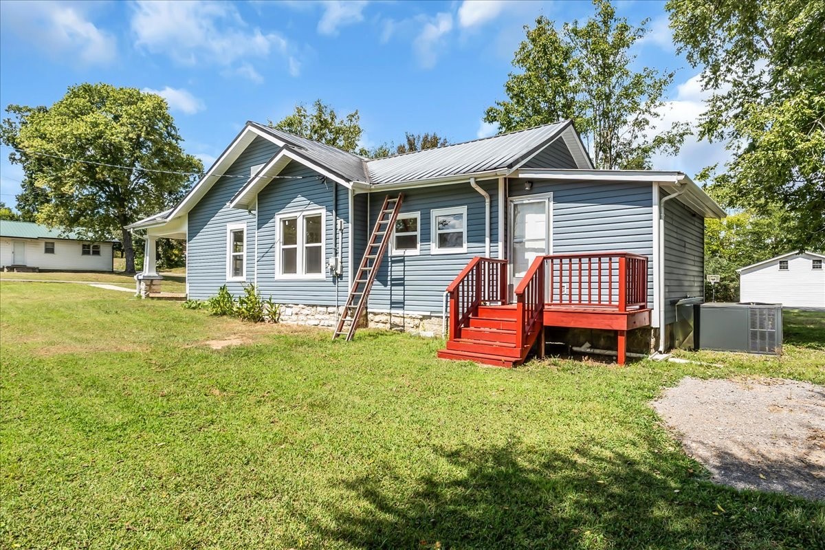 104 Locust Street Liberty, TN 37095 - Photo 35 of 57 a view of a house with a yard and sitting area