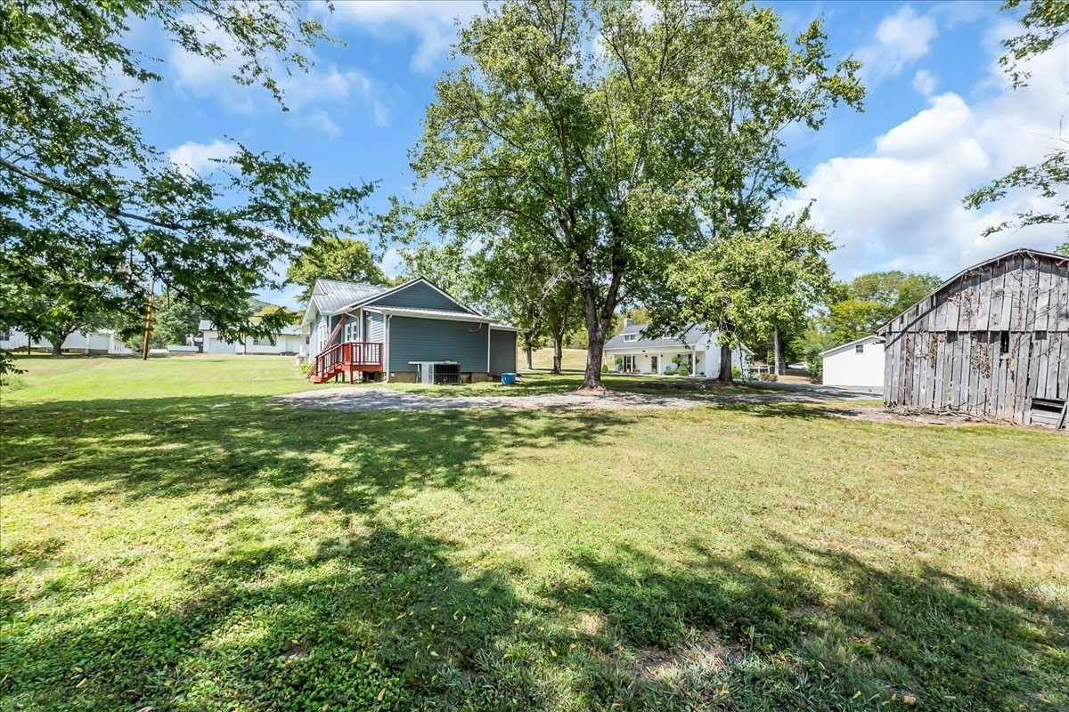 104 Locust Street Liberty, TN 37095 - Photo 40 of 57 a front view of house with yard and trees
