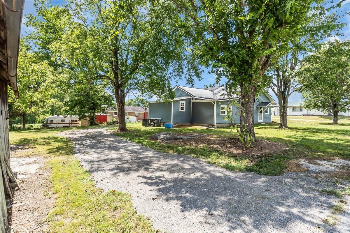 104 Locust Street Liberty, TN 37095 - Photo 42 of 57 a front view of a house with a yard
