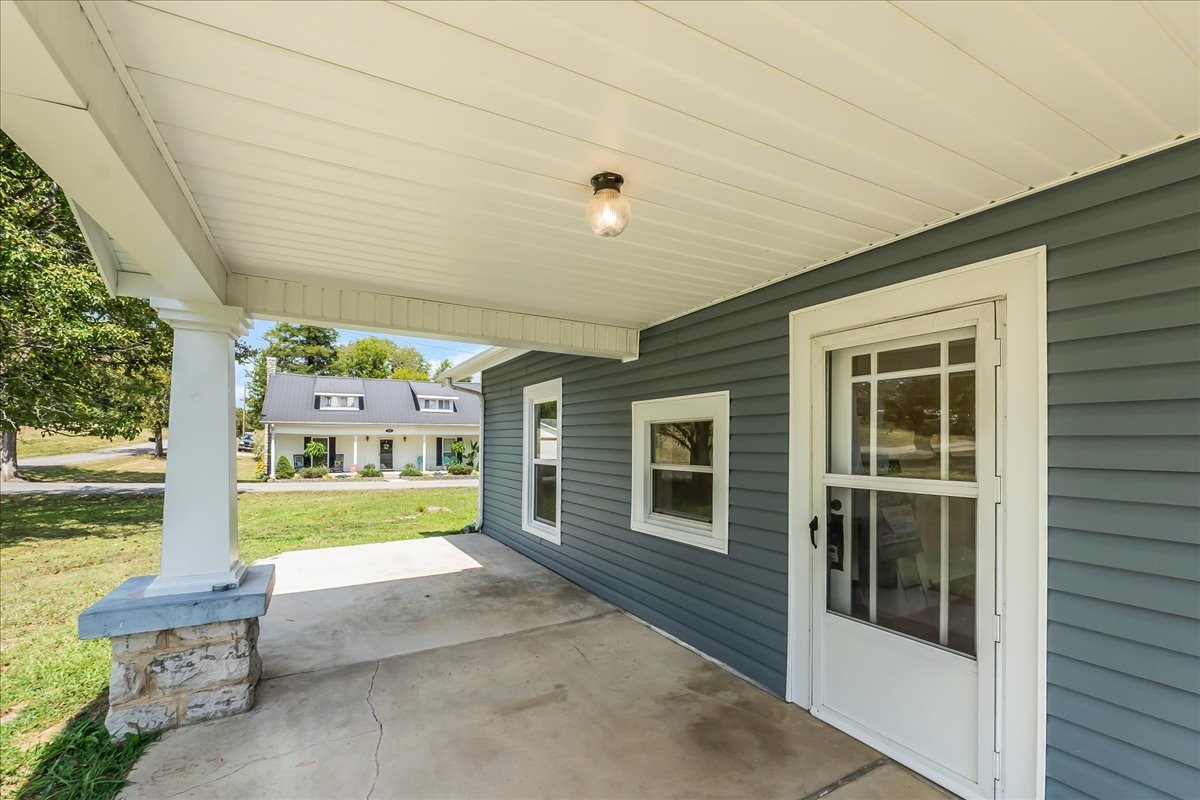 104 Locust Street Liberty, TN 37095 - Photo 49 of 57 a front view of a house with a yard and garage