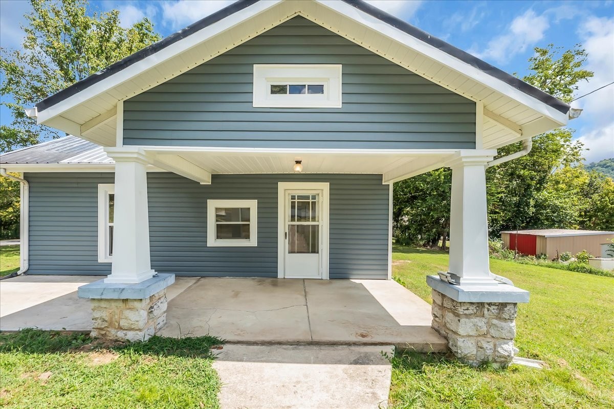 104 Locust Street Liberty, TN 37095 - Photo 50 of 57 a view of a house with a yard and sitting area