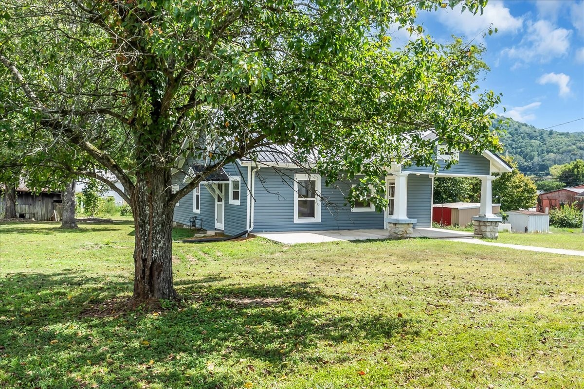 104 Locust Street Liberty, TN 37095 - Photo 51 of 57 a front view of a house with garden
